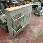 Radiator cover with shoe storage, drawers and solid oak top
