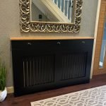 Black Radiator Cover with drawers and panel fretwork and a light Solid Oak Top