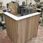 Bespoke reception desk, L shape, solid oak slats & cupboard