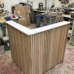 Bespoke reception desk, L shape, solid oak slats & cupboard
