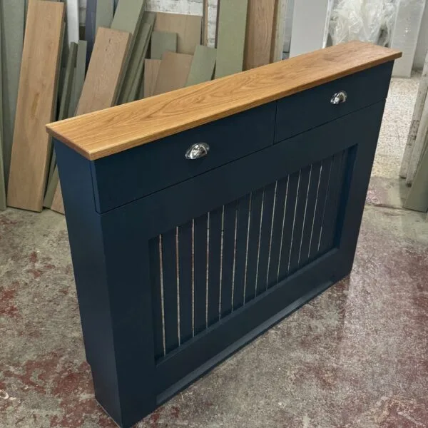 Custom white bespoke radiator cover with two functional drawers in a modern home