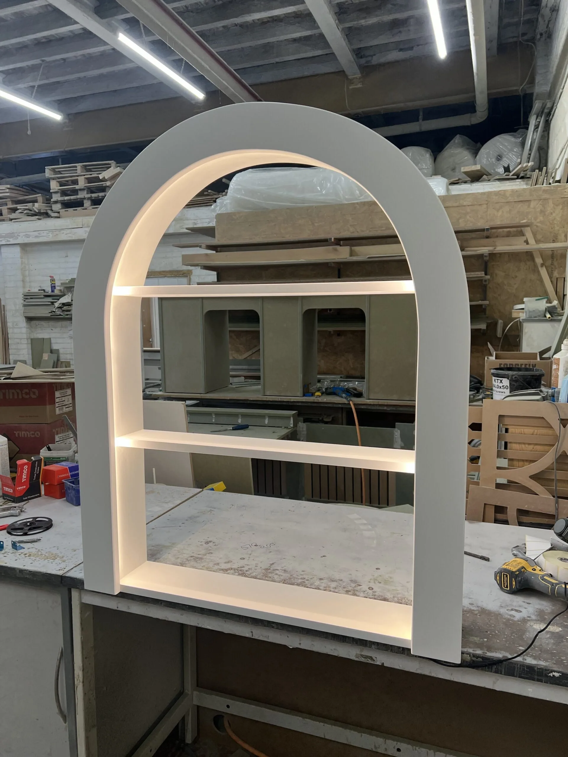 Elegant Skimming Stone Curved Floating Shampoo Display