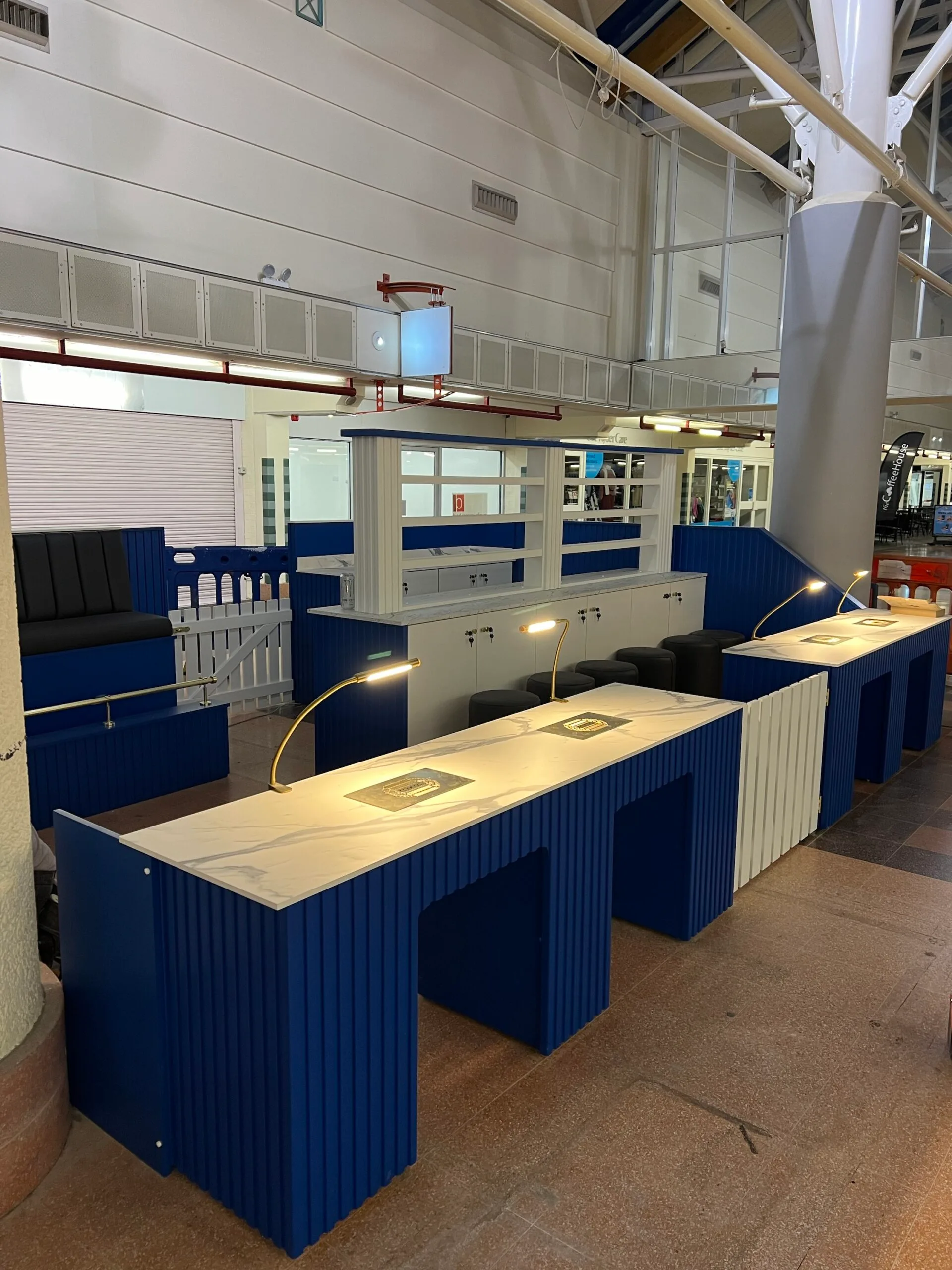 Bespoke nail desk, reeded design two person station, Signal Blue, Corian Top Shelf, Gold Fixtures