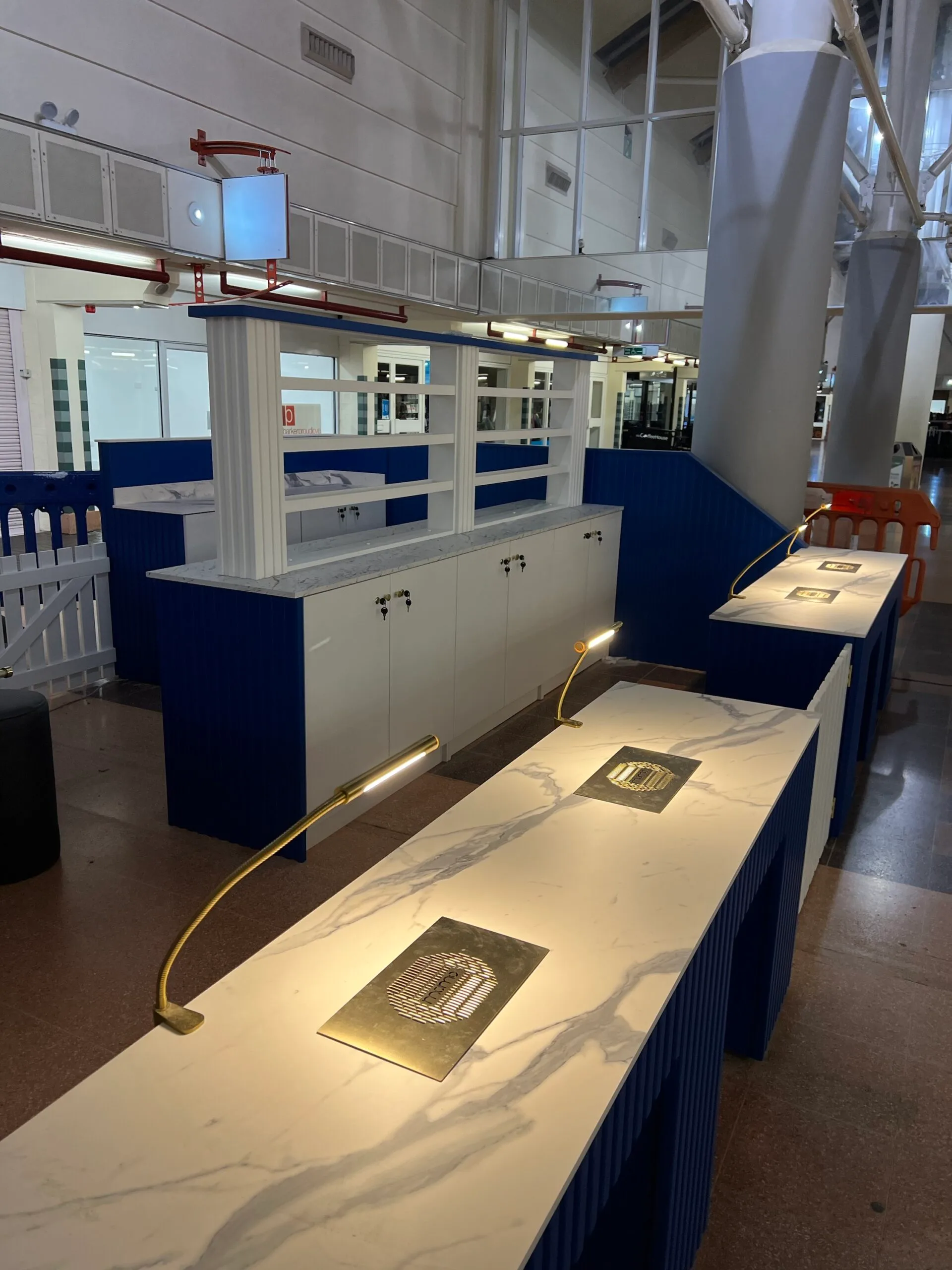 Bespoke nail desk, reeded design two person station, Signal Blue, Corian Top Shelf, Gold Fixtures