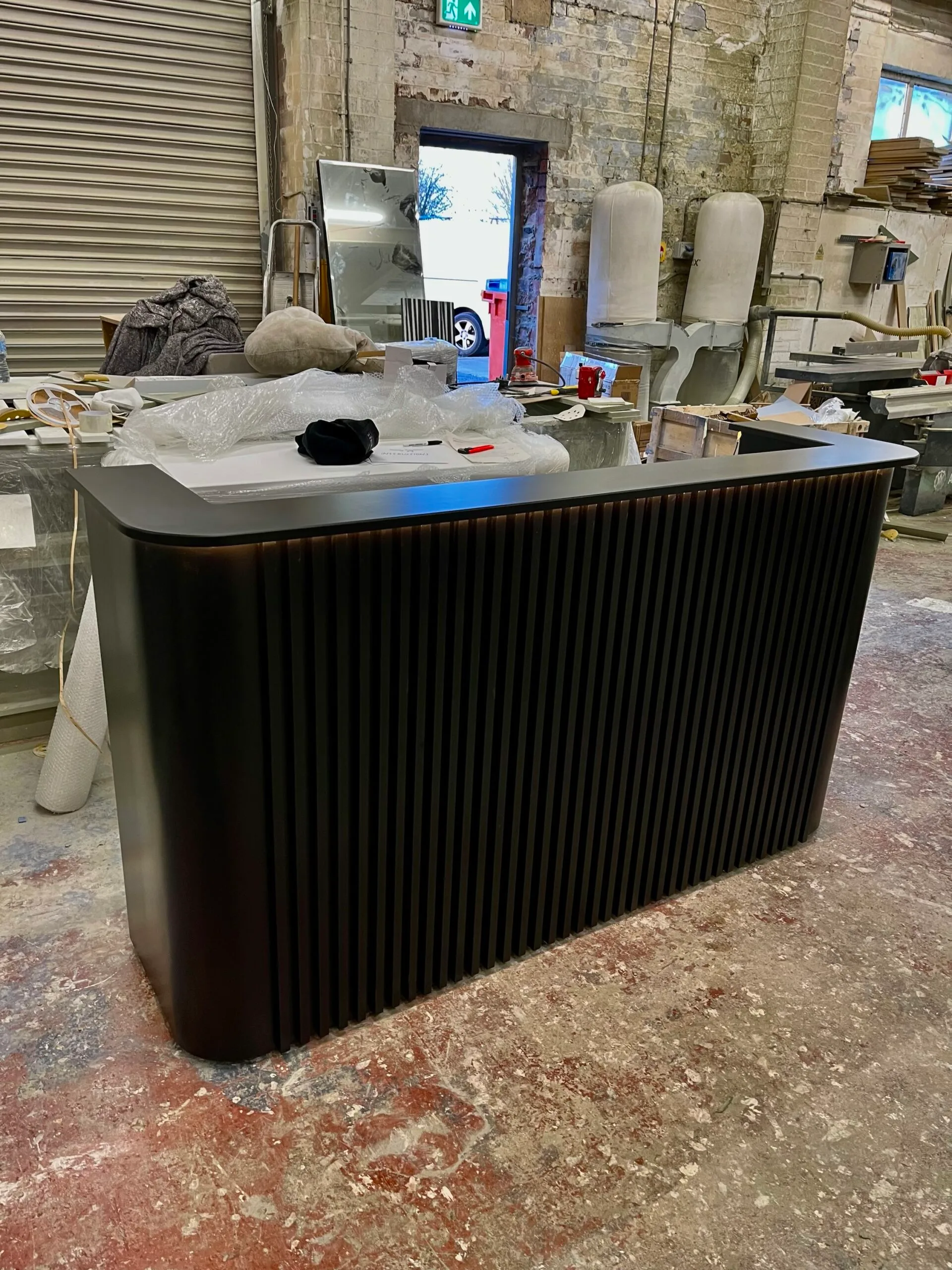 Bespoke Luxury Reception Desk, Black Reeded Design