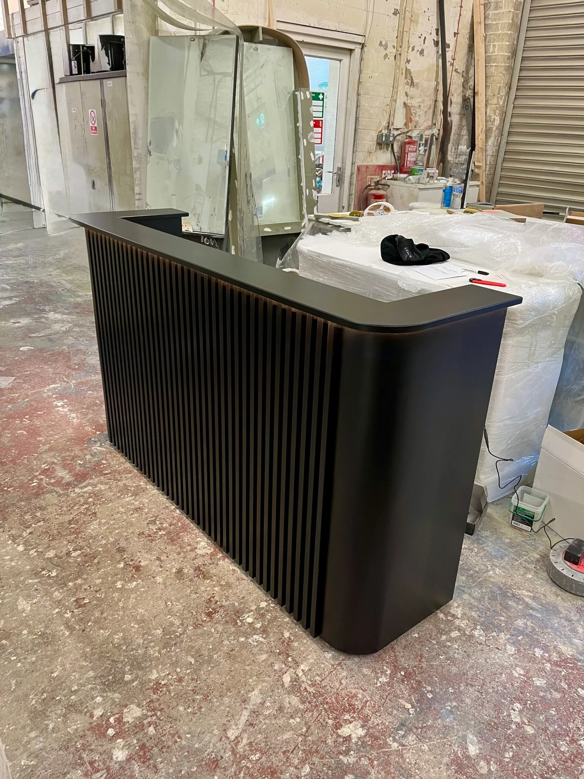 Bespoke Luxury Reception Desk, Black Reeded Design