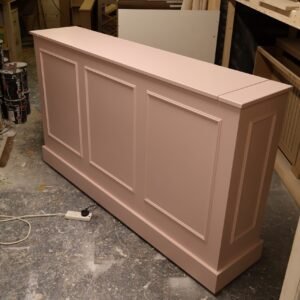 Bespoke motorised TV lift cabinet in Farrow and Ball Calamine pink with beaded panel design