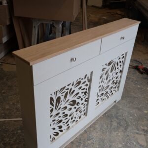 Bespoke white radiator cover with decorative floral grill pattern and natural oak top