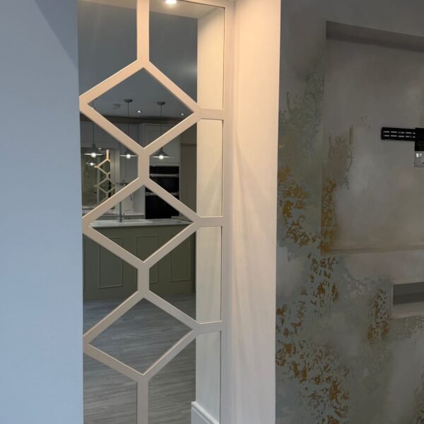 Bespoke grey diamond fretwork wall panelling with luxury mirrored backing for a feature wall
