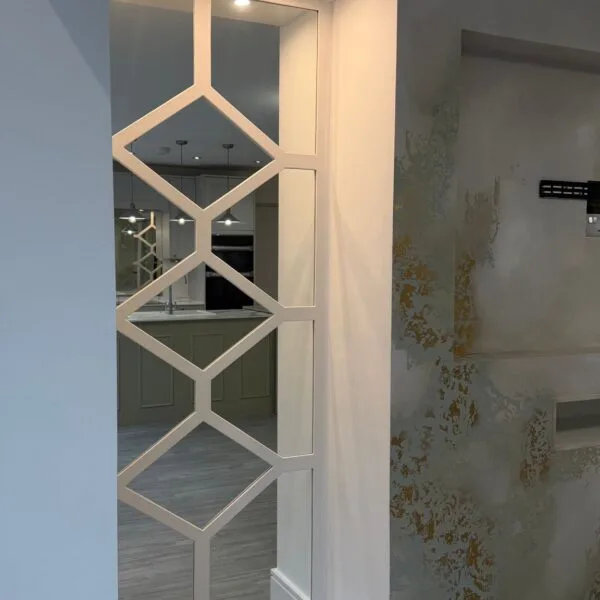 Bespoke grey diamond fretwork wall panelling with luxury mirrored backing for a feature wall