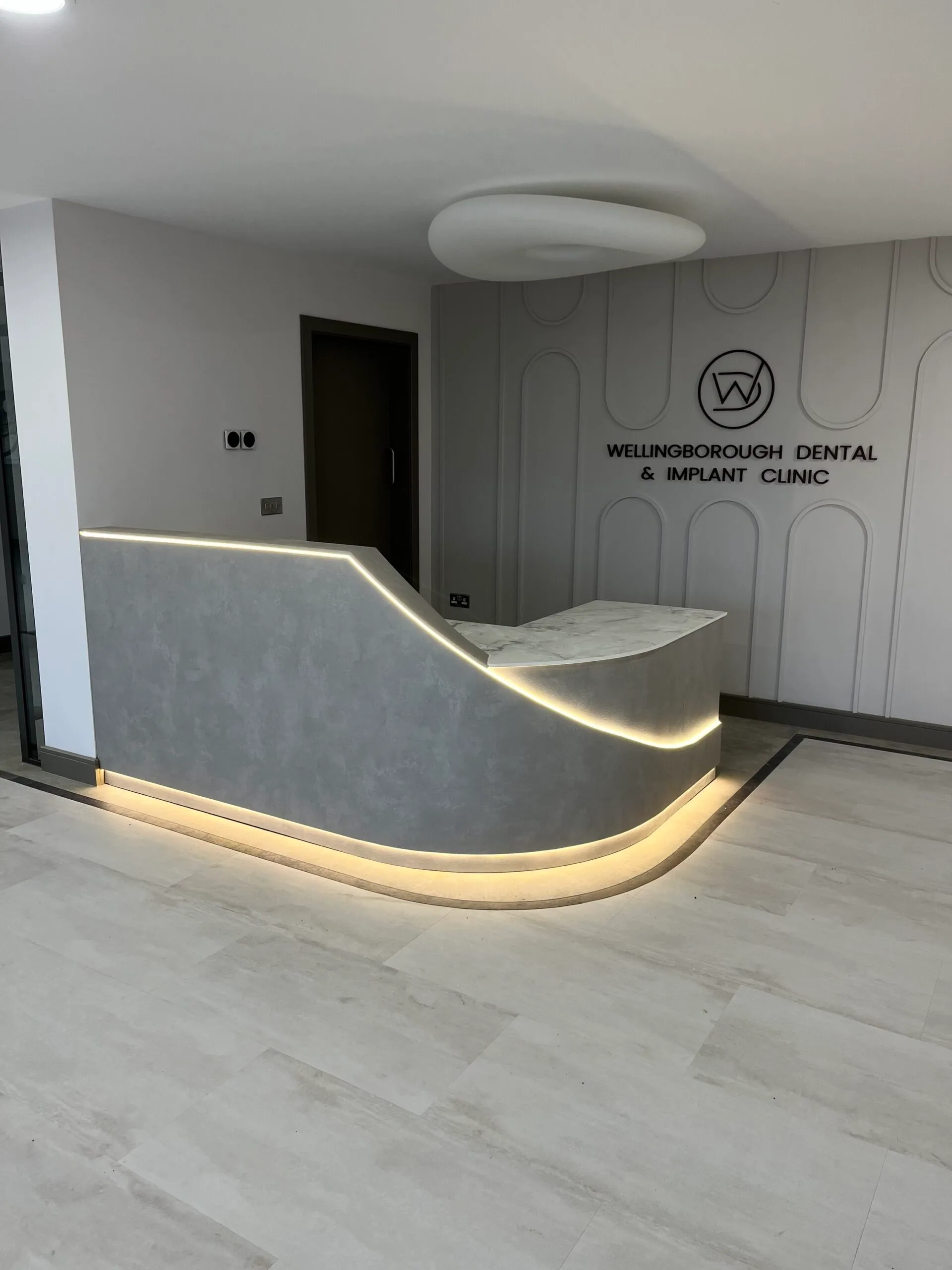Curved Reception Desk with Laminate Finish and Solid Corian Top