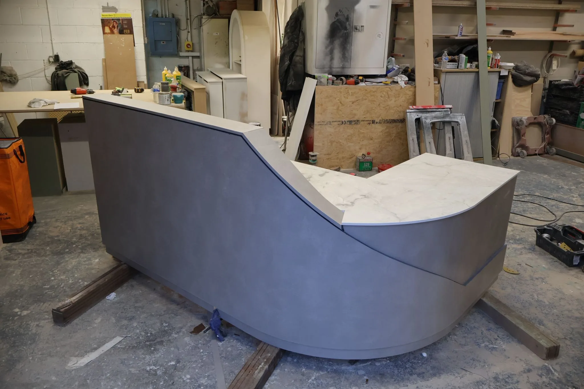 Curved Reception Desk with Laminate Finish and Solid Corian Top