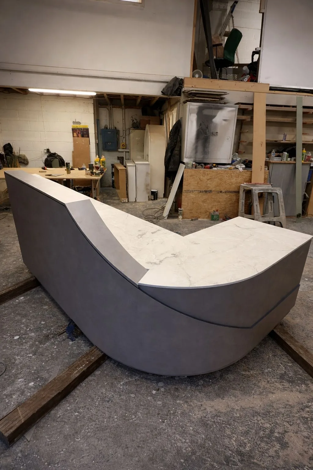 Curved Reception Desk with Laminate Finish and Solid Corian Top