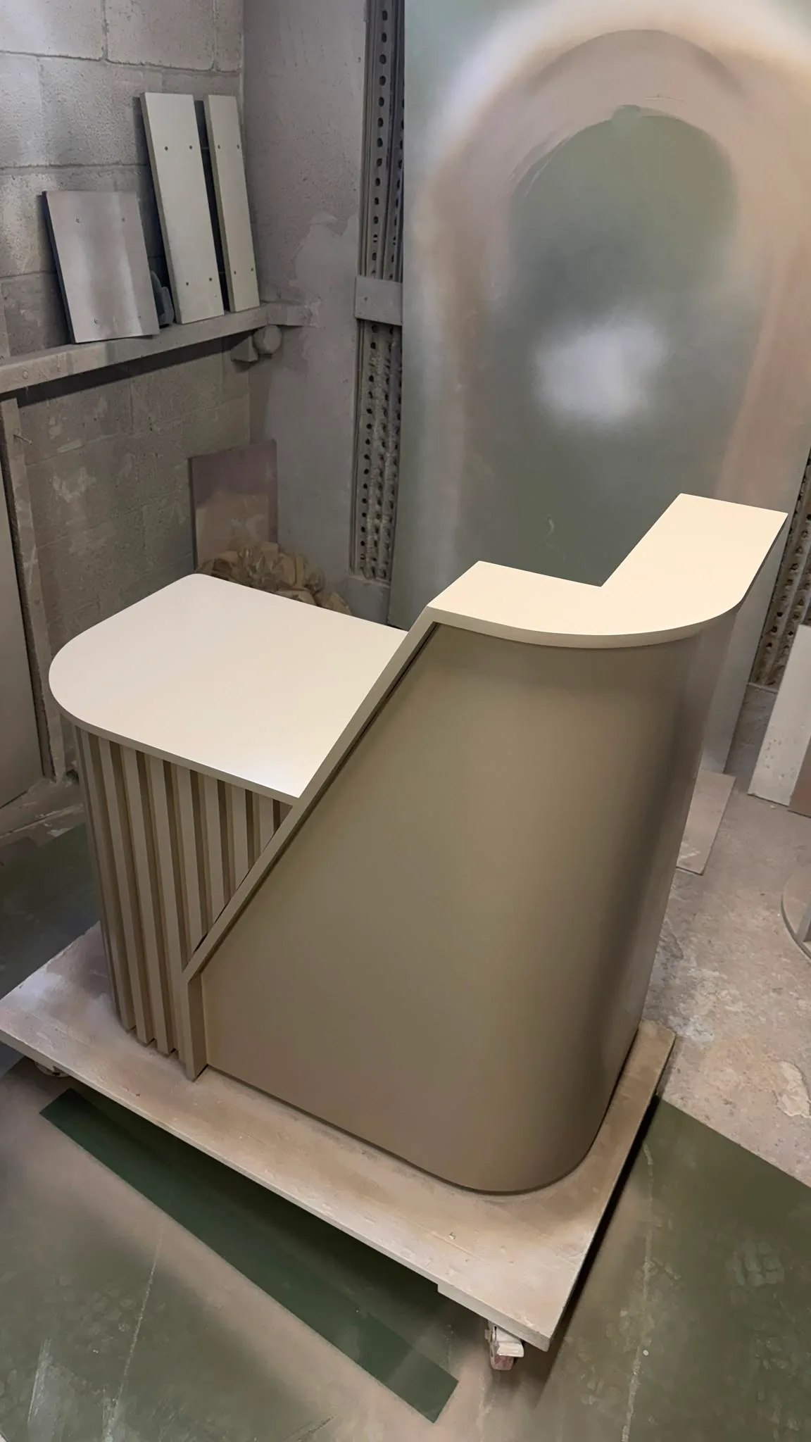 Bespoke reception desk with curved front and compact modern design