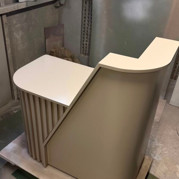 Bespoke reception desk with curved front and compact modern design