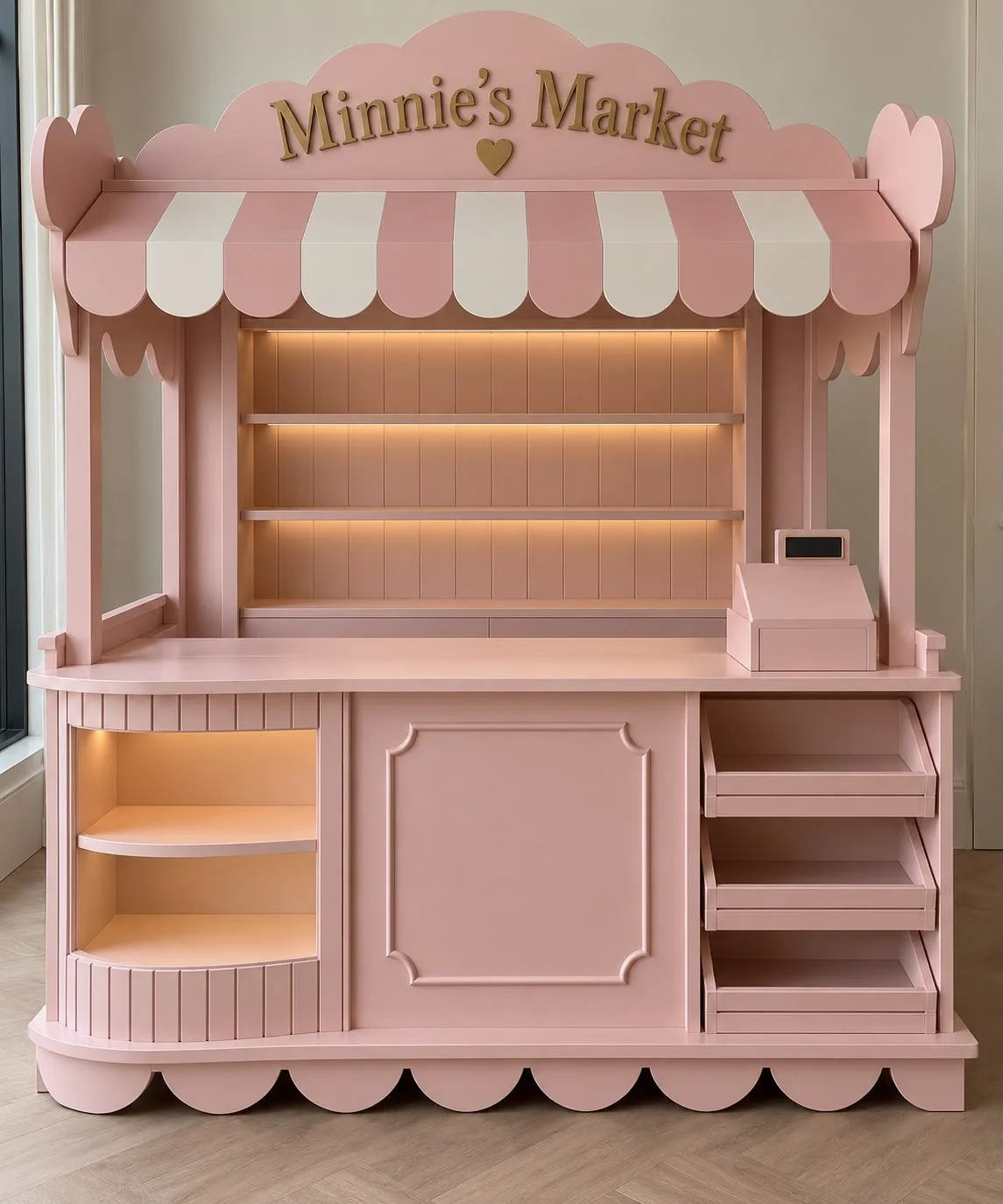 Handmade wooden Minnie's Market children's play market stall in pastel pink with integrated LED shelving and cash register