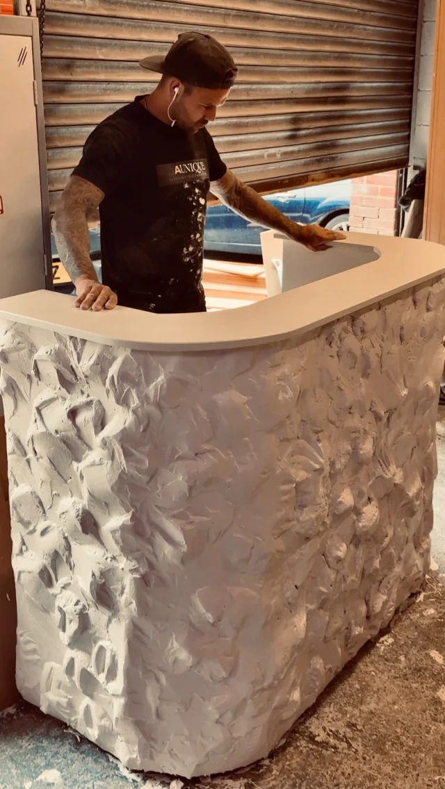 curved reception desk, handmade stone effect 🤍