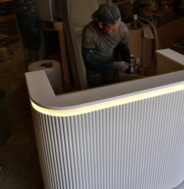 Bespoke reception desk, soft reeds & lighting lighting 🖤